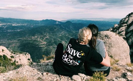 barcelona students hugging at overlook