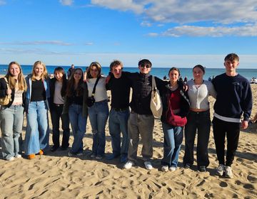 High school students in Alicante posing on beach