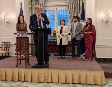 A Photo of Senator Bill Bradley addressing the audience from a podium at the Celebration of Youth Exchange event